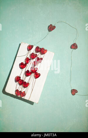 Perles coeur enroulé autour de Card Banque D'Images