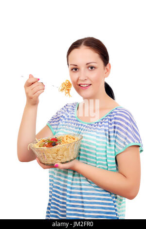 Teenage girl eating spaghetti Banque D'Images