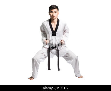 Portrait d'un homme asiatique professionnel avec la ceinture noire de Taekwondo fighter sur fond gris Banque D'Images