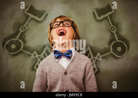 L'équipement de jardinage contre fond blanc contre boy laughing in front of blackboard Banque D'Images