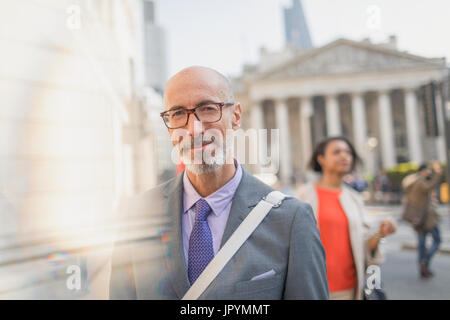 Portrait confident businessman on urban city Street, London, UK Banque D'Images