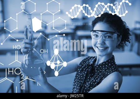 Illustration de la structure chimique contre portrait of smiling schoolgirl faisant une expérience chimique in laboratory Banque D'Images