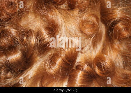 Les boucles de cheveux rouge Banque D'Images