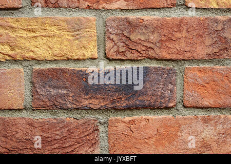 Vieux mur de briques colorées texture background pattern. Banque D'Images