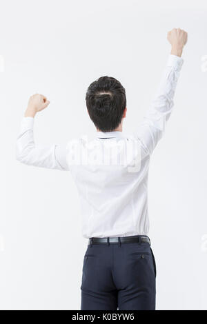 Dos de jeune businessman cheering Banque D'Images