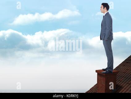 Digital composite of businessman standing on Roof avec cheminée et ciel bleu Banque D'Images