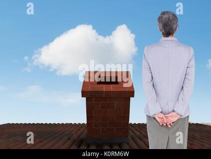 Digital composite of Businesswoman standing on Roof avec cheminée et ciel bleu Banque D'Images