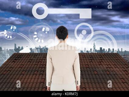 Digital composite de l'icône et l'interface et Businesswoman standing on Roof avec ciel ville Banque D'Images