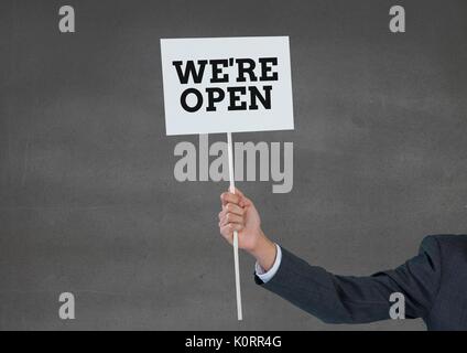 Digital composite of business man holding une carte avec nous sommes open text Banque D'Images