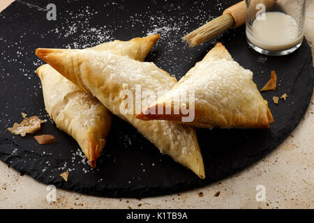 Pêche gingembre tartes à la main Banque D'Images