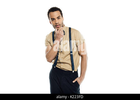 Pensive young african american man de toucher son visage et looking at camera isolated on white Banque D'Images