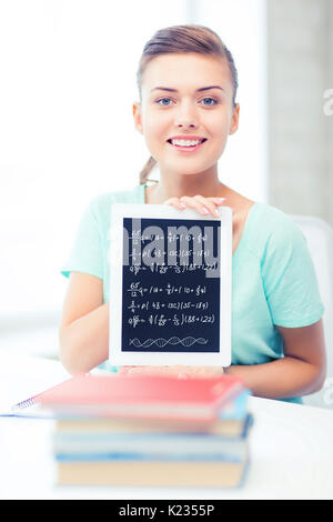 Smiling student girl with tablet pc Banque D'Images