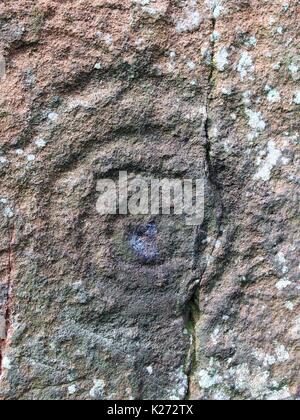 Tasse-et-ring détails de sculpture sur pierre meg, Cumbria, Royaume-Uni Banque D'Images