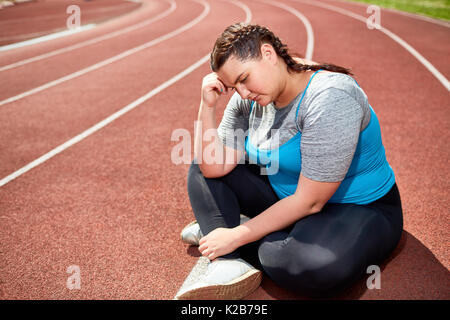 Femme sur racetrack Banque D'Images