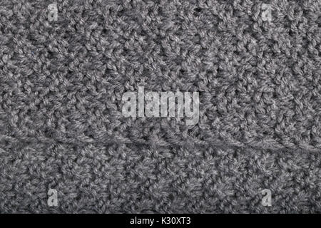 Close up d'un tricot fait main tissu laine cachemire gris Banque D'Images