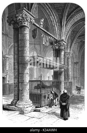 1870 : les visiteurs et un prêtre passant la pierre tombale et bronze effigie de Edouard de Woodstock, également connu comme le Prince Noir dans la Cathédrale de Canterbury, Kent. Le 14e prince est le fils aîné du roi Édouard III et de Philippa de Hainault et mort le 8 juin 1376 (45 ans) dans le Palais de Westminster, Londres, Angleterre. Banque D'Images