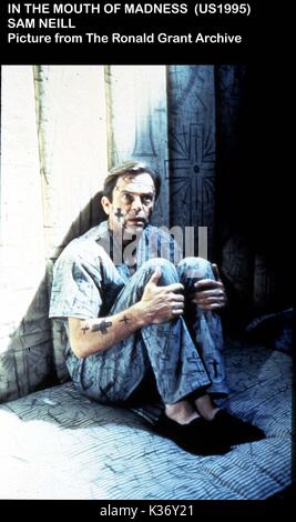 Dans LA BOUCHE DE FOLIE SAM NEILL Date : 1995 Banque D'Images