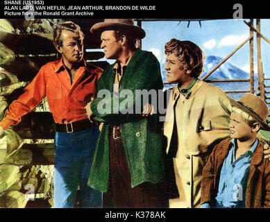 SHANE ALAN LADD, VAN HEFLIN, JEAN ARTHUR, BRANDON DE WILDE Date : 1953 Banque D'Images