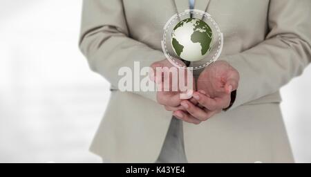 Digital composite of business woman holding a globe avec des connecteurs Banque D'Images