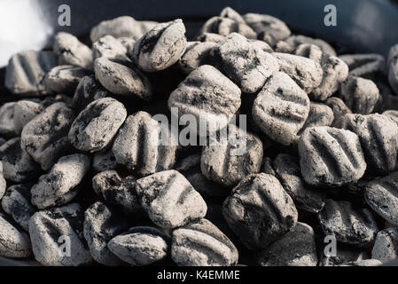 Close-up of hot pit BBQ briquettes de charbon, de l'alimentation arrière-plan ou la texture. Banque D'Images
