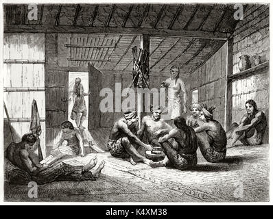 Les Dayak ancienne la vie quotidienne dans une hutte. Ils obtiennent de vous détendre dans une faible lumière intérieure. Par Lancon après colonies Hollandaises atlas iconographique publié sur le Tour du Monde Paris 1862 Banque D'Images