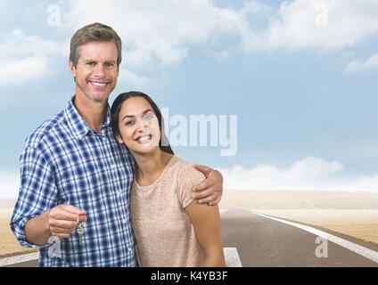 Digital composite de couple maintenant la touche en face de road Banque D'Images