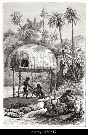 L'ancienne petite grange frais généraux dans African village entouré par la jungle et les personnes conduisant leur vie. Créé par Girardet et Sargent après Bolognesi publié sur le Tour du Monde Paris 1862 Banque D'Images