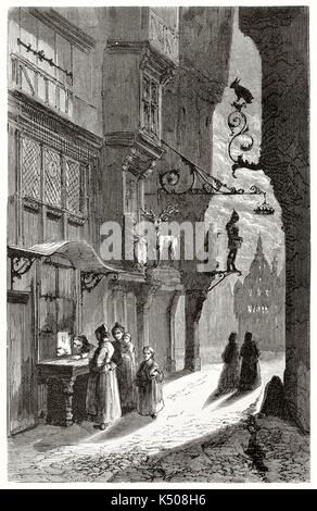 Peuple ancien dans une ruelle sombre de la ville médiévale sont en attente devant une petite fenêtre boulangerie à Ulm, Allemagne. Publié sur le Tour du Monde Paris 1862 Banque D'Images