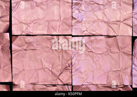 Gros plan d'une feuille d'aluminium froissé rose, texture, full frame, télévision lay, patron des cubes, horizontal Banque D'Images