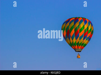 Colorful Hot Air Balloon Against Blue Sky Background