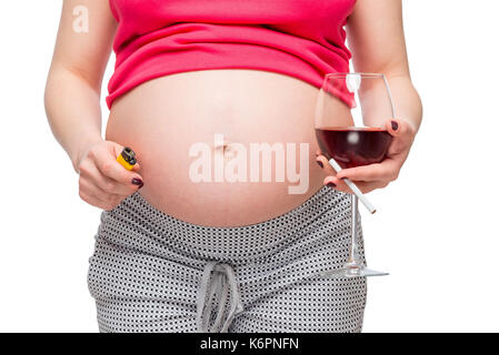 Ventre d'une femme enceinte close-up, une femme a de mauvaises habitudes - photo concept Banque D'Images