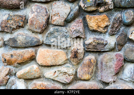La texture de fond d'un vieux mur de pierre Banque D'Images