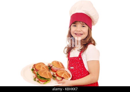 Happy little girl cook avec sandwiches Banque D'Images