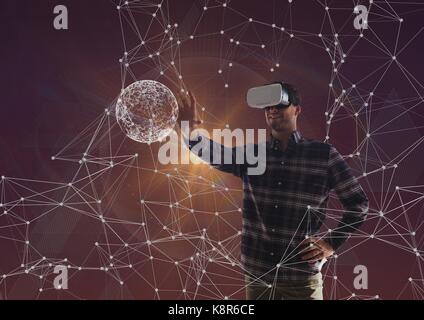Digital composite de l'homme souriant avec casque vr Banque D'Images