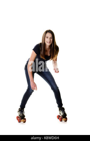 Teen girl essayant de roller skate Banque D'Images