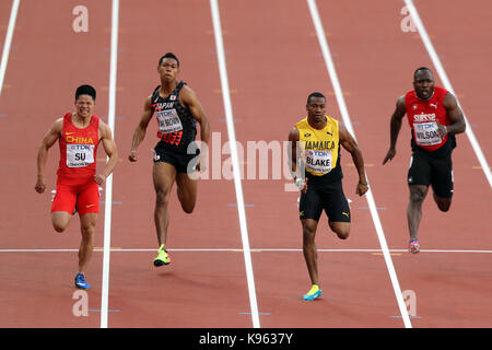 Alex Wilson (Suisse), YOHAN BLAKE (Jamaïque), Abdul Hakim SANI BROWN (Japon), Bingtian SU (Chine) au début de la demi-finale du 100 m hommes 2 à 2017, les Championnats du monde IAAF, Queen Elizabeth Olympic Park, Stratford, London, UK. Banque D'Images