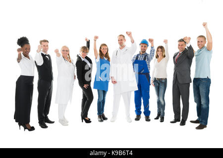 Portrait de personnes avec diverses professions cheering against white background Banque D'Images