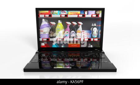 Magasinage en ligne concept avec ordinateur portable et produits de nettoyage Banque D'Images