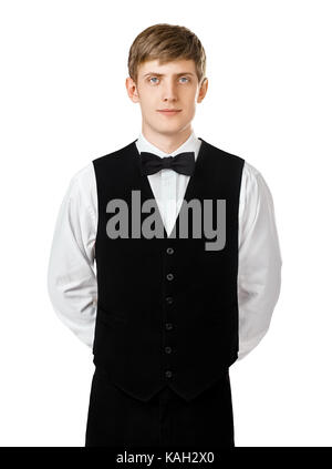 Portrait de jeune garçon confiant debout avec les mains derrière le dos isolé sur fond blanc Banque D'Images