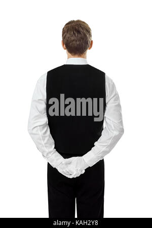 Vue arrière du jeune garçon confiant debout avec les mains derrière le dos isolé sur fond blanc Banque D'Images