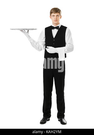 Portrait of handsome waiter holding élégant plateau d'argent vide isolé sur fond blanc Banque D'Images