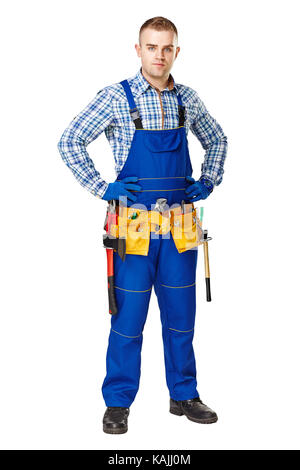 Full Length portrait of young male construction worker avec ceinture d'outils isolé sur fond blanc Banque D'Images