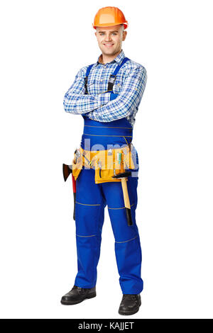 Full Length portrait of young male construction worker portant des vêtements, casque et ceinture d'outils isolé sur fond blanc Banque D'Images