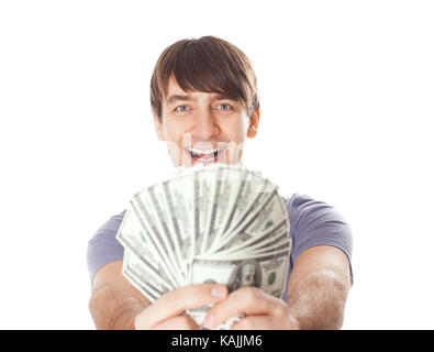 Portrait of a young smiling man holding a dollar bills isolé sur fond blanc Banque D'Images