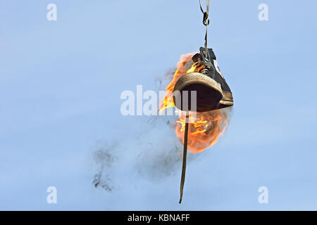 Burning converse against a blue sky Banque D'Images