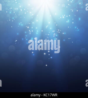 La lumière vers le bas et l'étoile qui tombe sur un fond bleu de fête Banque D'Images