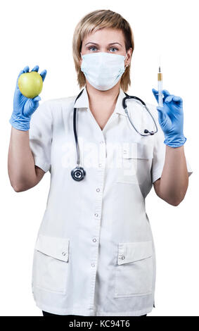 Femme médecin avec la pomme verte et d'une seringue. Banque D'Images