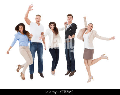 Un multi excité les gens raciale cheering in front of white background Banque D'Images