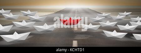 Composite numérique du groupe de bateaux en papier sur route Banque D'Images