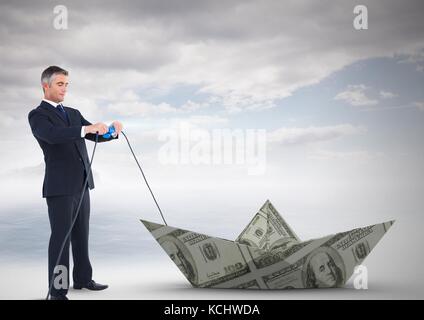 Digital composite de Businessman pulling papier-monnaie dollar voile Banque D'Images